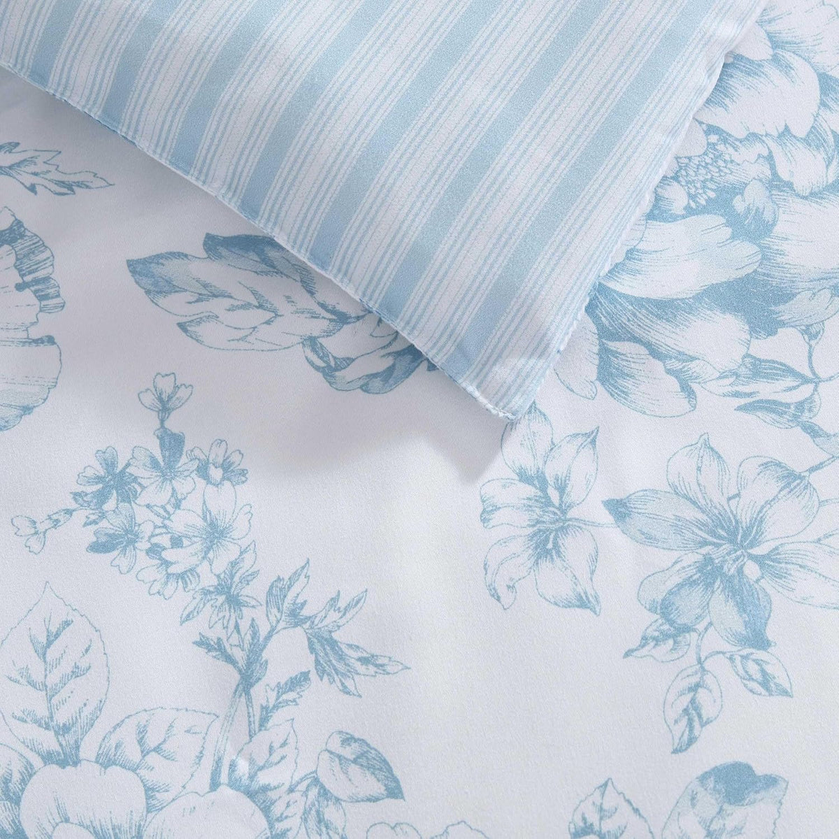 Laura Ashley - Queen Comforter Set, Soft & Reversible Floral Bedding with Bonus Bed Sheets & Pillowcases, 7 Piece Bed Set for Year Round Comfort (Delphine Saras/Sprig Blue)